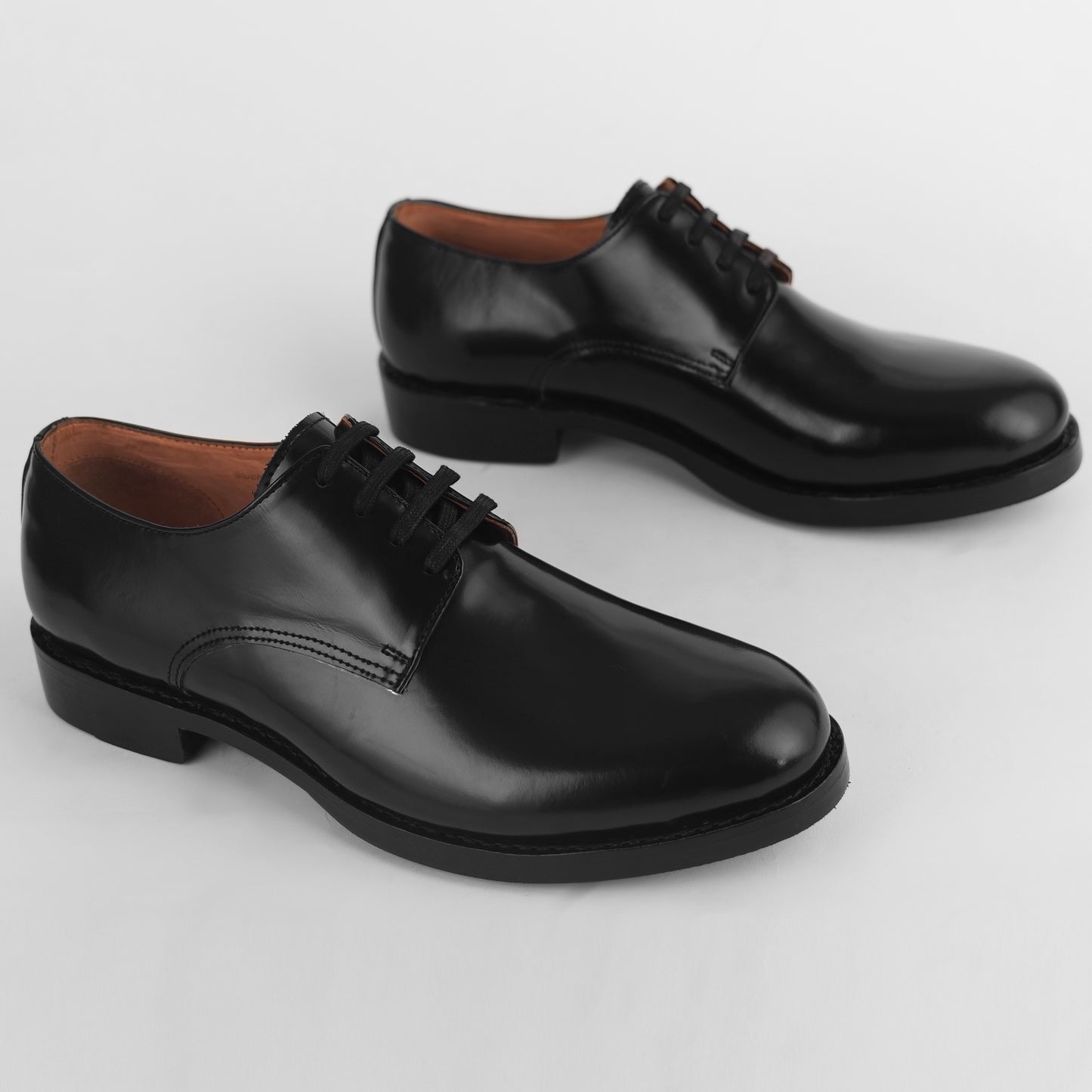 Top view of black Blucher Goodyear welted shoes with lace-up closure