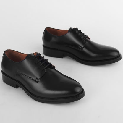 Top view of black leather Blucher Stud Series shoes showing overall pair design