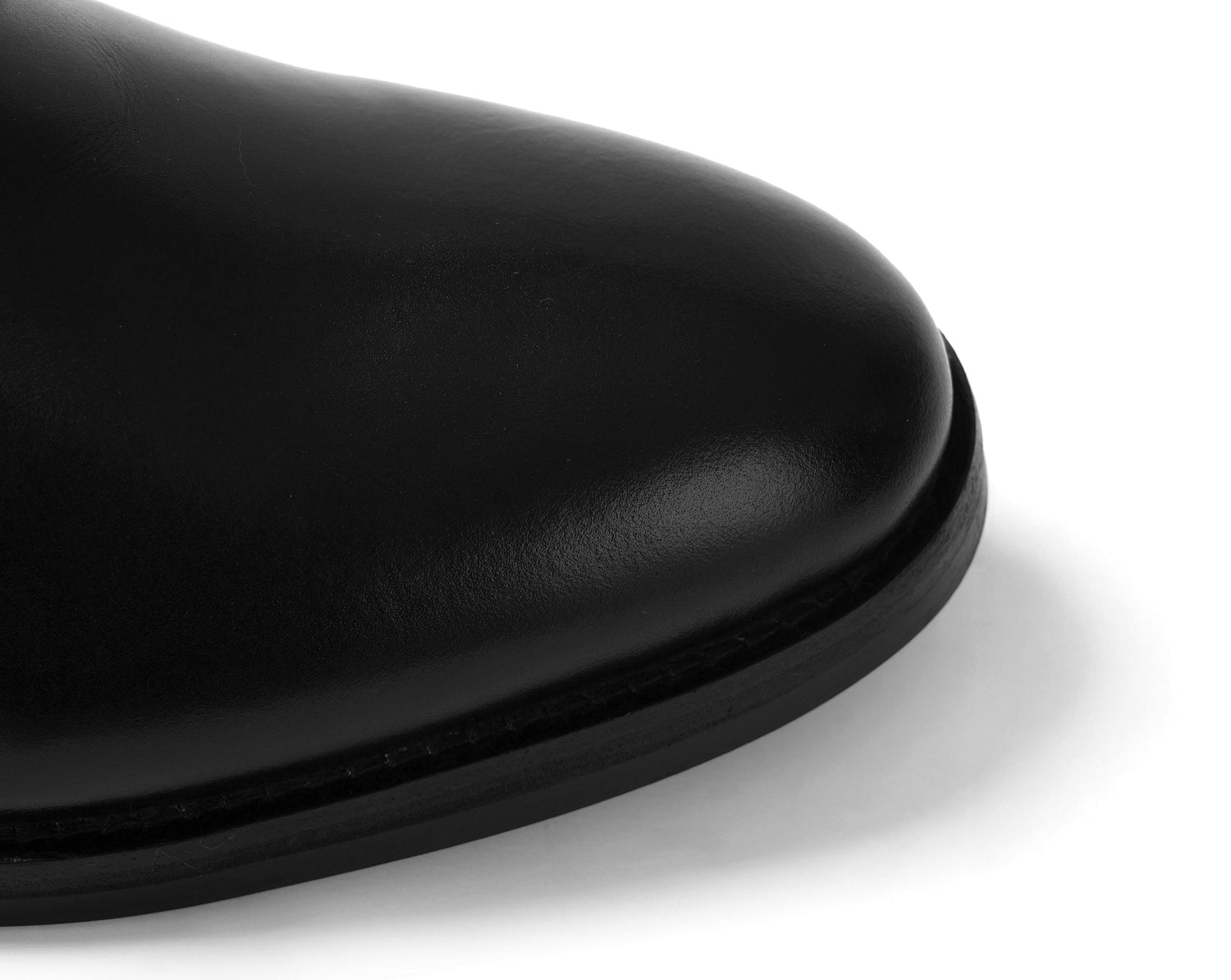 Black leather Blucher shoe with stud sole highlighting clean toe design and upper leather quality