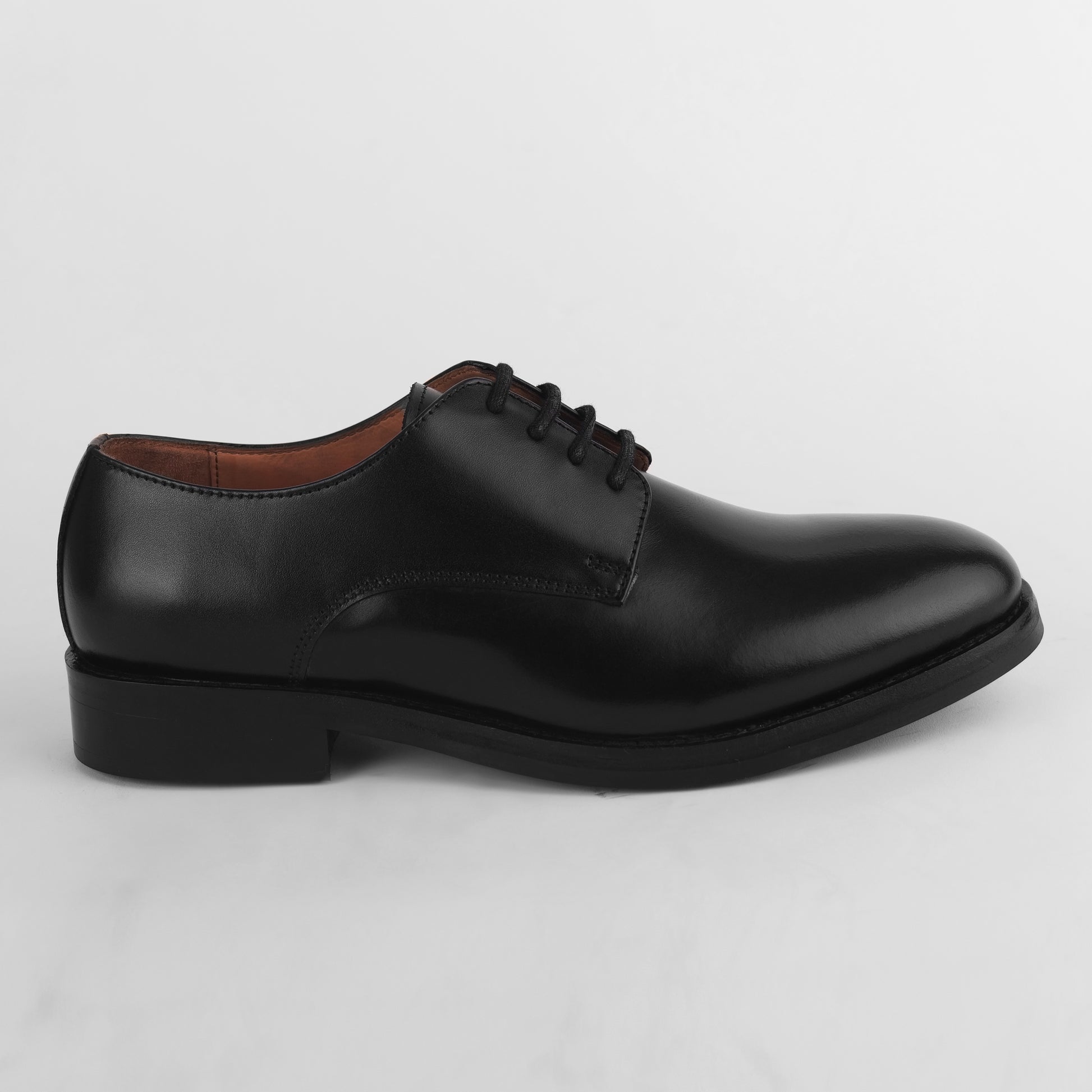 Side view of black leather Blucher Stud Series shoe showing overall design