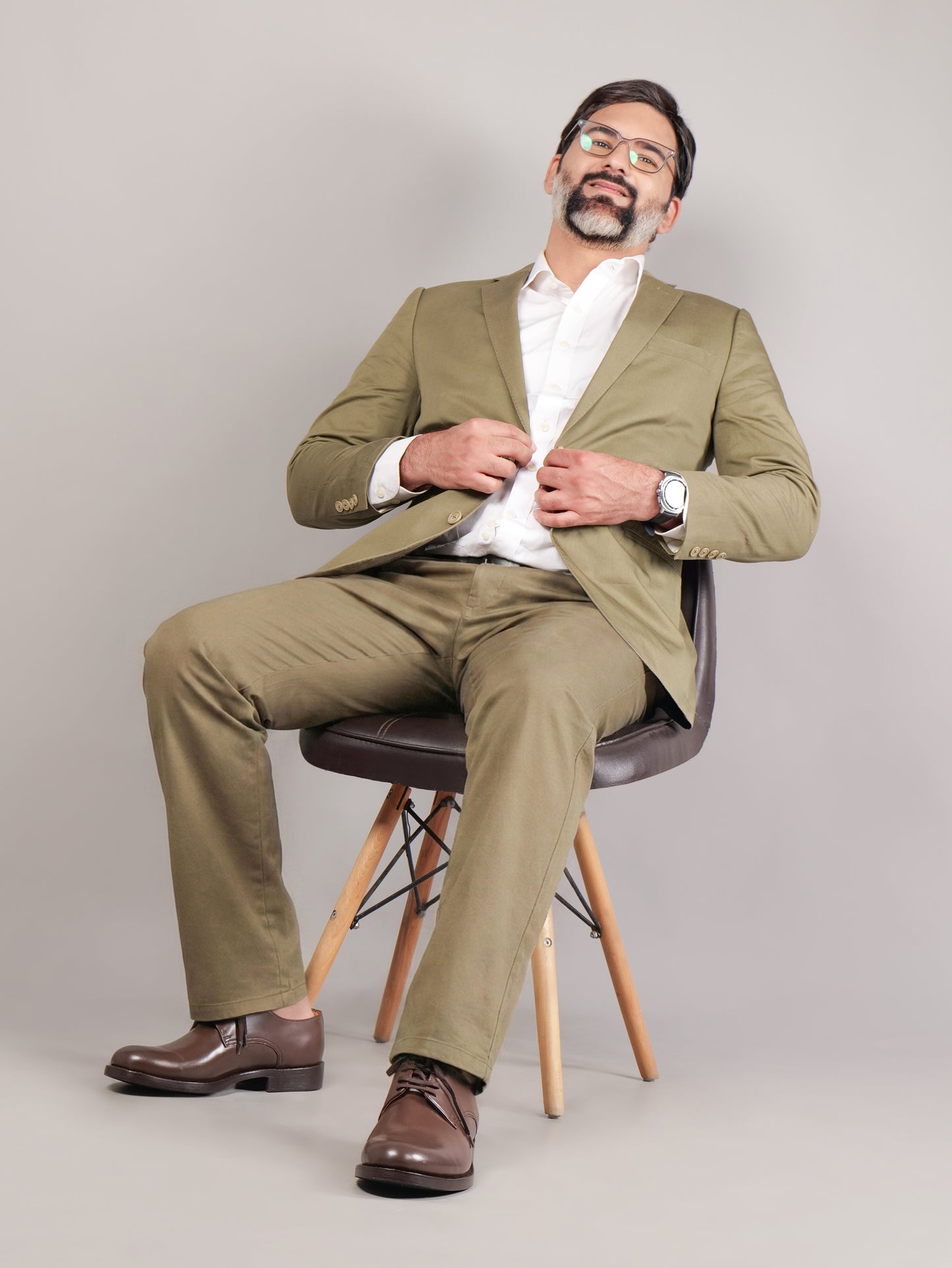 Blucher Classic Executive brown leather Blucher shoes worn by male model sitting on a chair