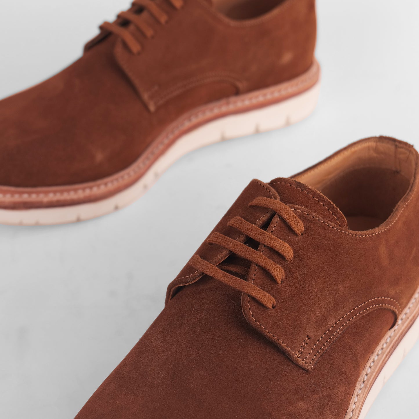 Close-up of brown Blucher Suede shoe highlighting lace detail