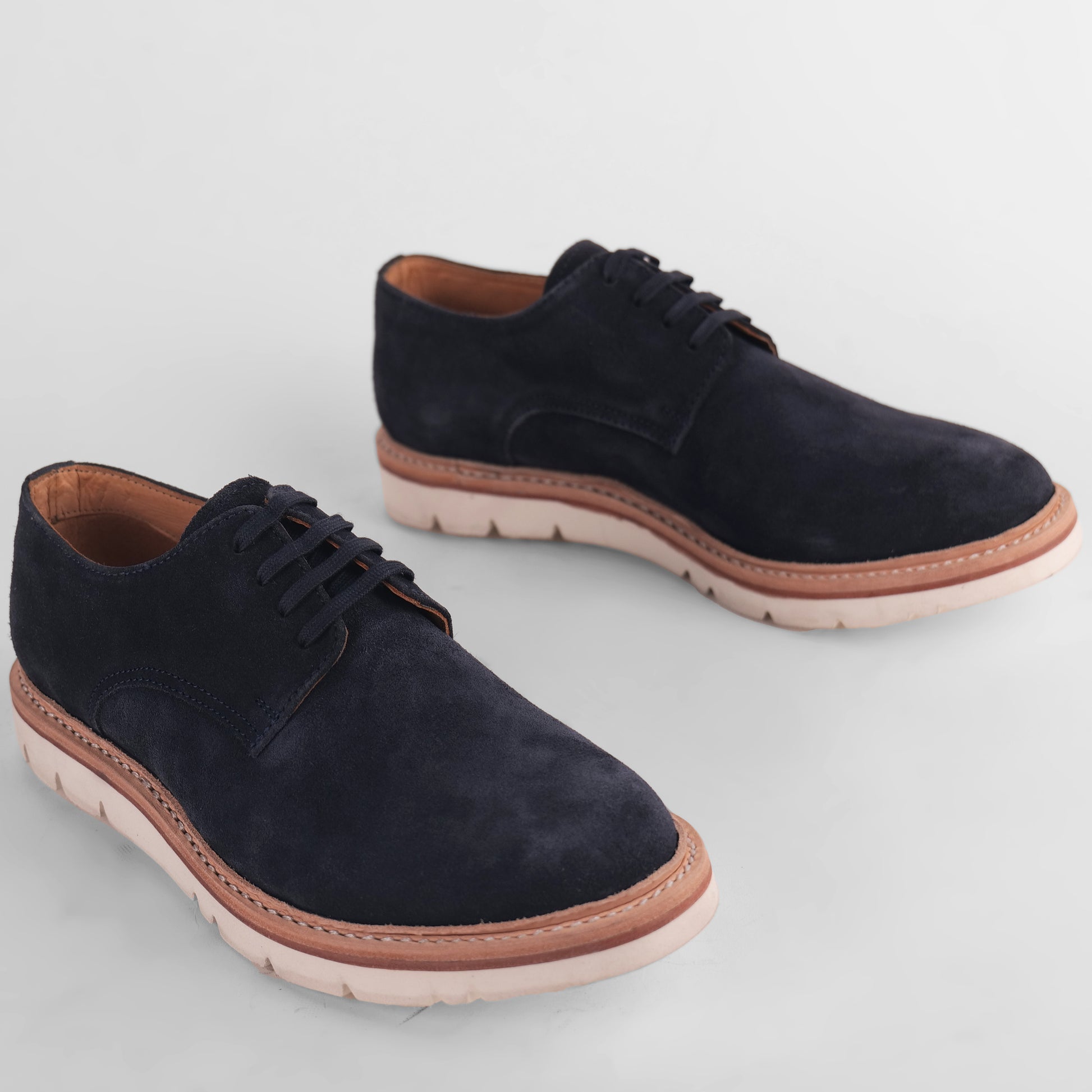 Top view of a pair of navy blue Blucher Suede shoes